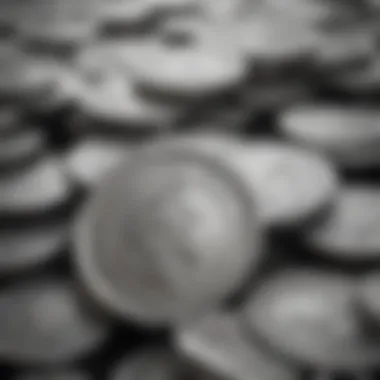 A close-up of silver coins stacked artistically