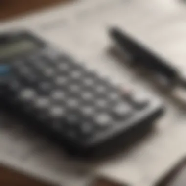 Close-up of pen and calculator on tax documents